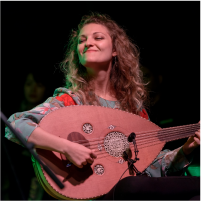 person playing acoustic instrument